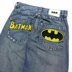 Blue Batman graphic jeans with wide legs and rear pocket patches