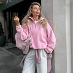 Women's pink textured pullover with stand collar and quarter-zip front