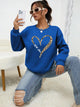 Women's crew-neck sweatshirt with leopard heart graphic and long sleeves