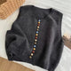 Sleeveless knit vest with scoop neck and multicolour front buttons