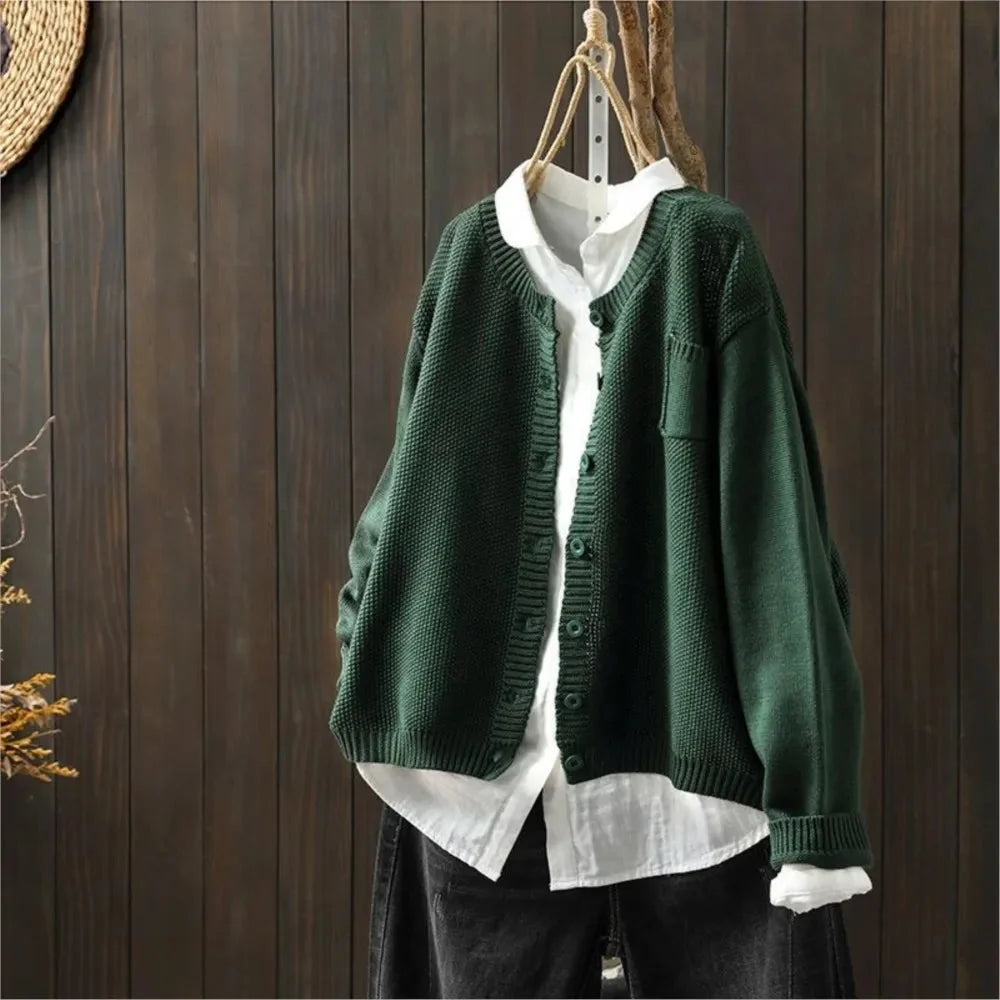 Women's textured knit cardigan with buttons over a white shirt