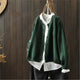 Women's textured knit cardigan with buttons over a white shirt