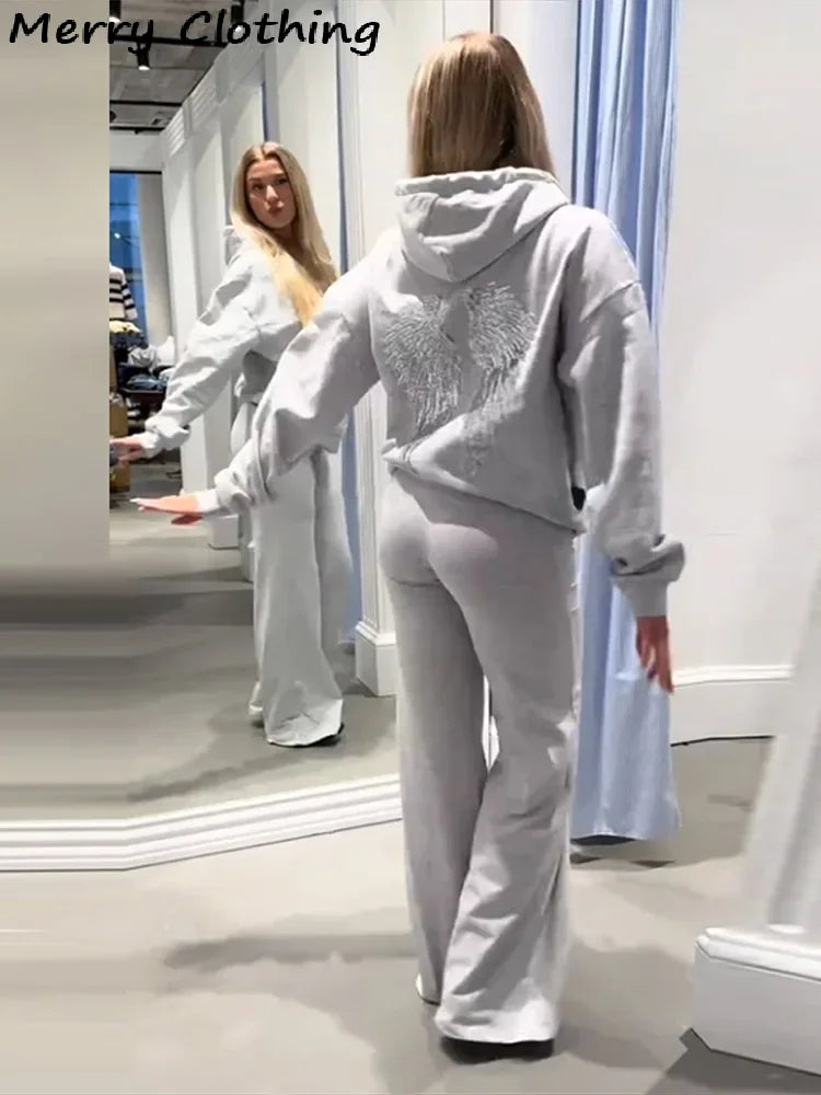 Women's hooded hoodie with large sequin wing motifs on the back
