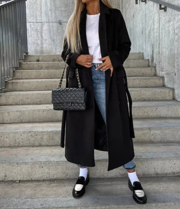 Women's long belted trench coat with notched lapels and double-breasted buttons