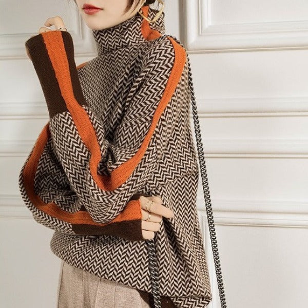 Women's herringbone turtleneck sweater with orange and brown contrast trim