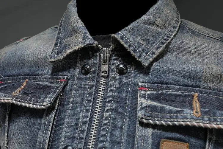 Men's faded blue denim jacket with long sleeves, zip front and chest pockets