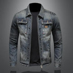 Men's faded blue denim jacket with long sleeves, zip front and chest pockets