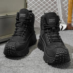 Men's high-top running shoes with lace-up fronts and lugged soles