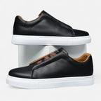 Men's low-top lace-up sneakers with panelled upper and flat white sole