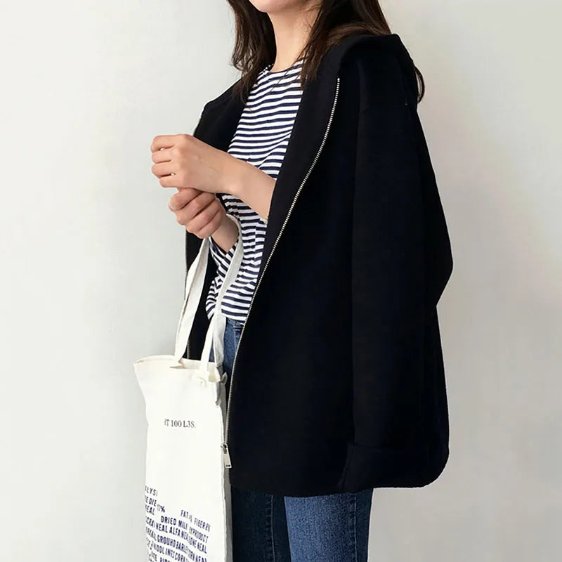 Women's hooded zip jacket with long sleeves and front pockets in beige and black