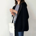 Women's hooded zip jacket with long sleeves and front pockets in beige and black