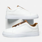 Men's low-top lace-up sneakers with panelled upper and flat white sole