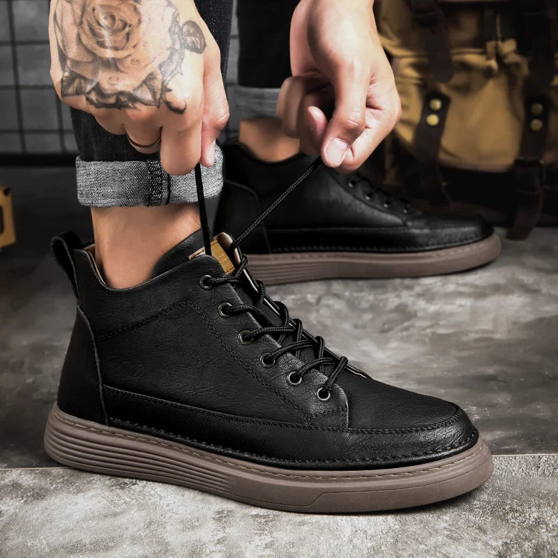 Men's lace-up ankle boots with stitched panels and platform sole