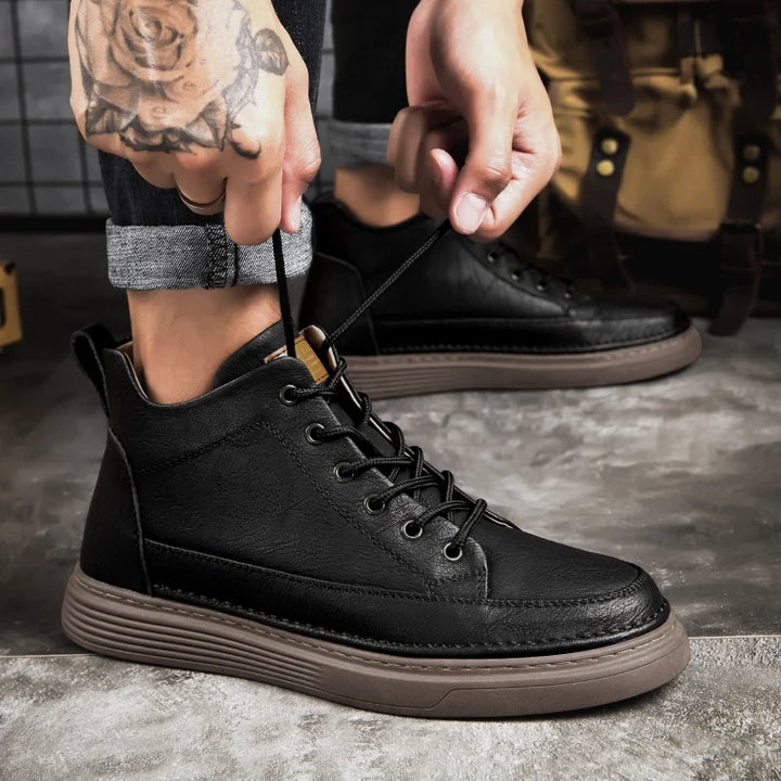 Men's lace-up ankle boots with stitched panels and platform sole