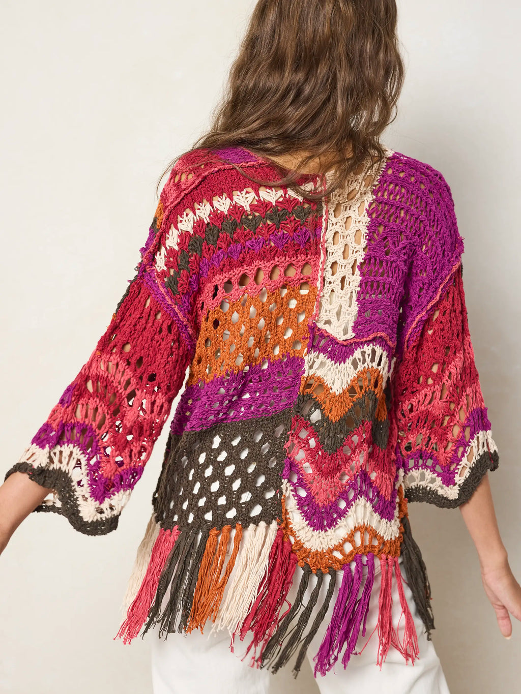 Women's multicolor crochet sweater with fringe hem and three quarter sleeves