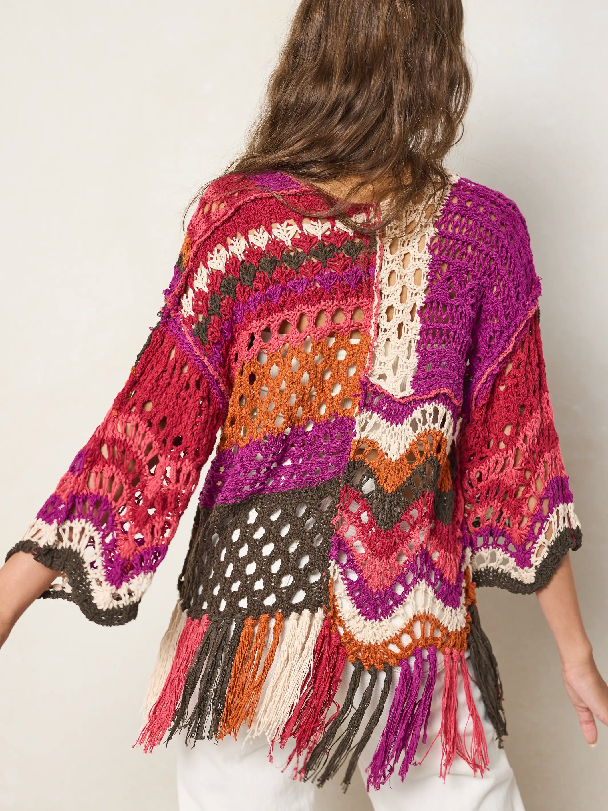 Women's multicolor crochet sweater with fringe hem and three quarter sleeves