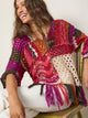 Women's multicolor crochet sweater with fringe hem and three quarter sleeves
