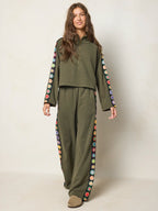 Women's olive half zip sweatshirt with floral sleeve panels