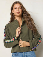 Women's olive half zip sweatshirt with floral sleeve panels