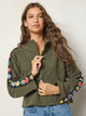 Women's olive half zip sweatshirt with floral sleeve panels