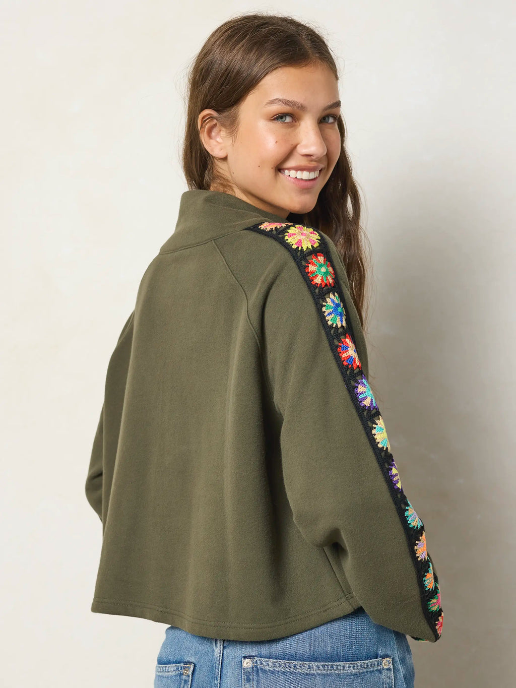 Women's olive half zip sweatshirt with floral sleeve panels
