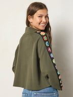 Women's olive half zip sweatshirt with floral sleeve panels