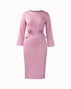 Women's long-sleeve fitted pencil dress with peplum waist and rosette details
