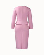 Women's long-sleeve fitted pencil dress with peplum waist and rosette details