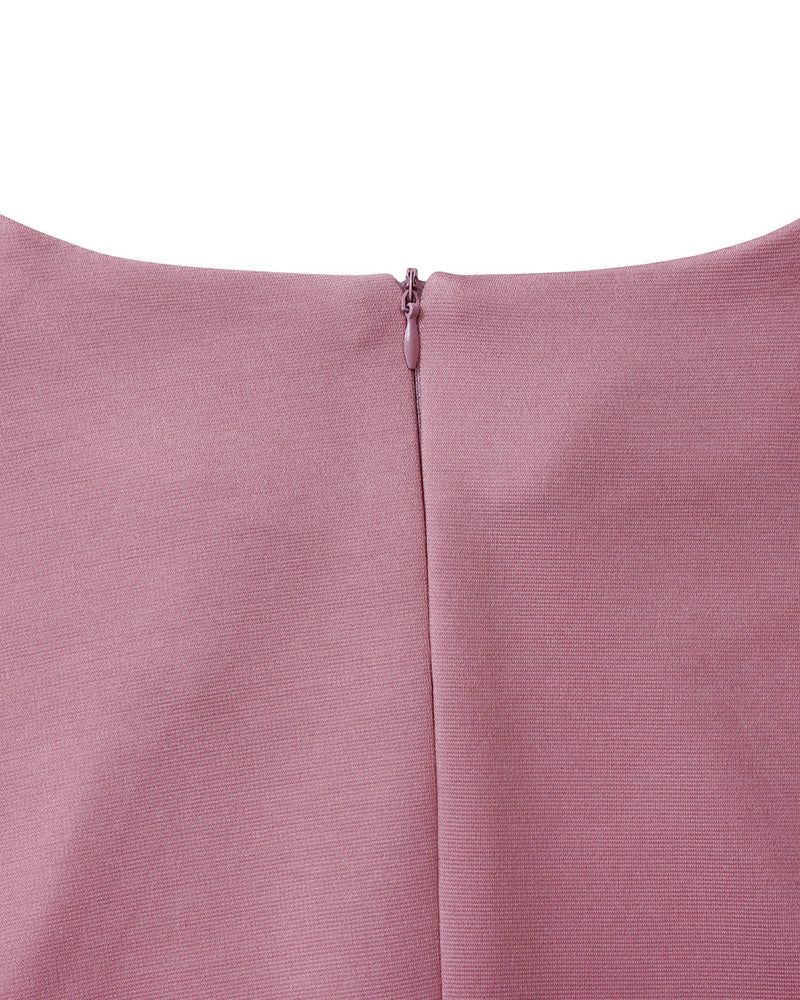 Women's long-sleeve fitted pencil dress with peplum waist and rosette details