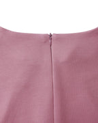 Women's long-sleeve fitted pencil dress with peplum waist and rosette details