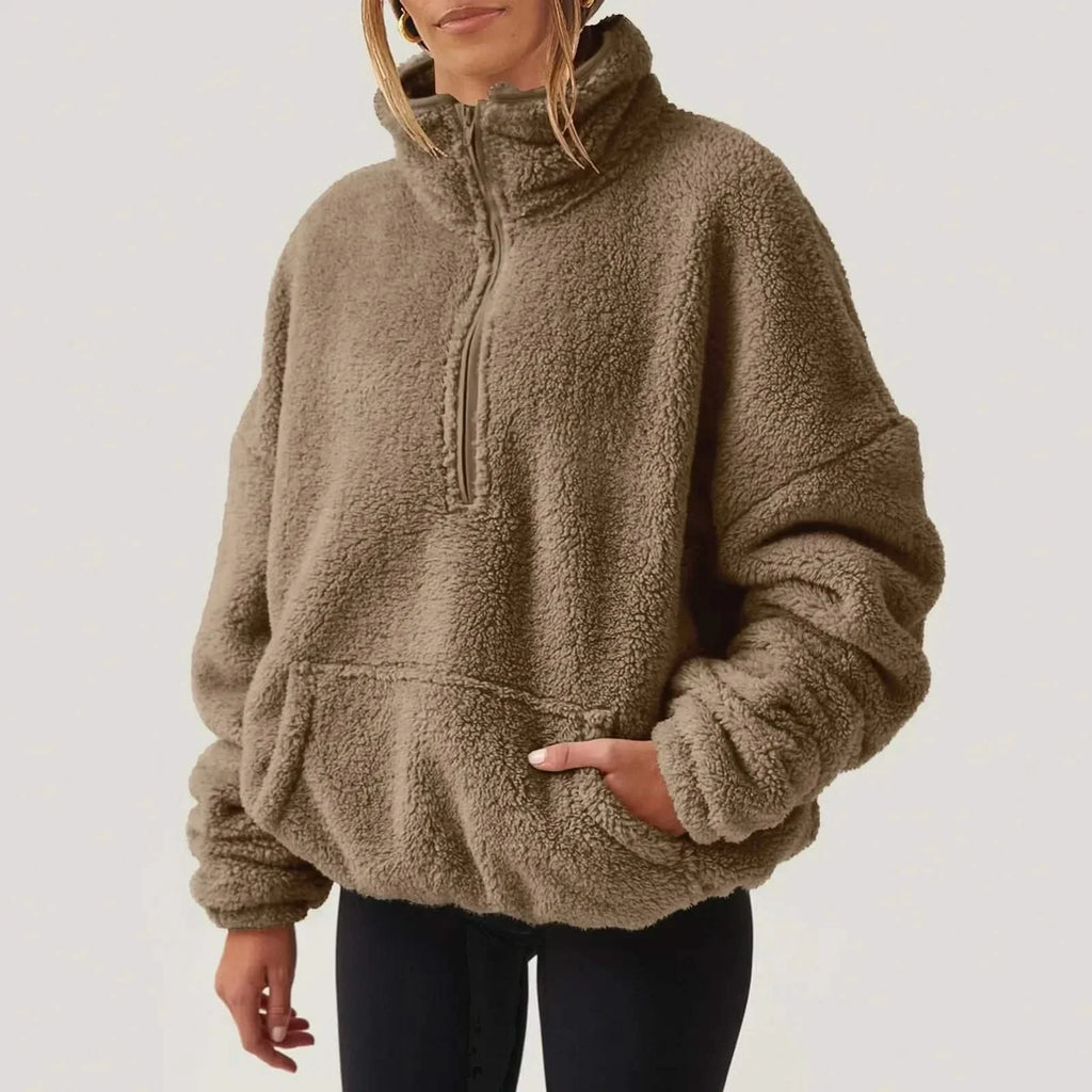 Women's textured hooded half-zip sweater with long sleeves and front pocket