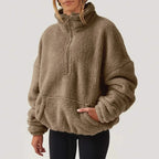 Women's textured hooded half-zip sweater with long sleeves and front pocket