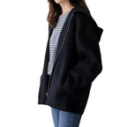 Women's hooded zip jacket with long sleeves and front pockets in beige and black