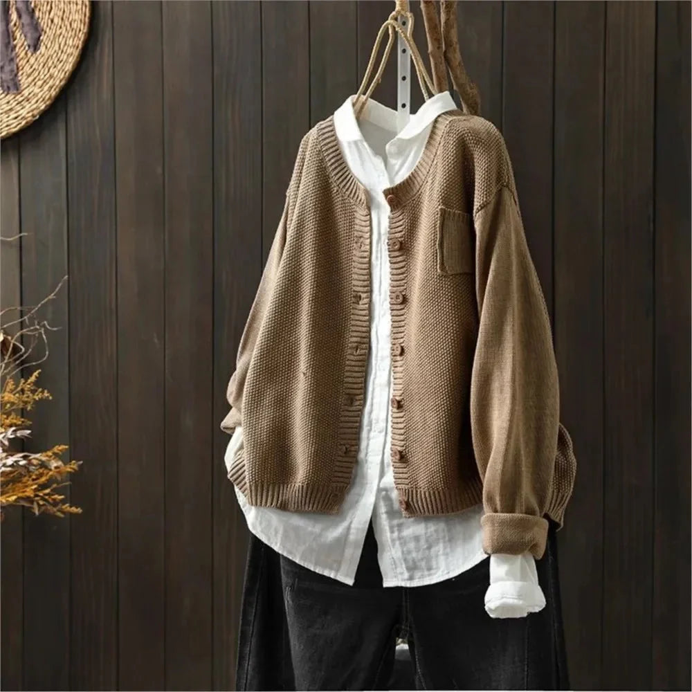 Women's textured knit cardigan with buttons over a white shirt