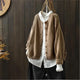 Women's textured knit cardigan with buttons over a white shirt