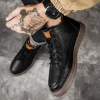Men's lace-up ankle boots with stitched panels and platform sole