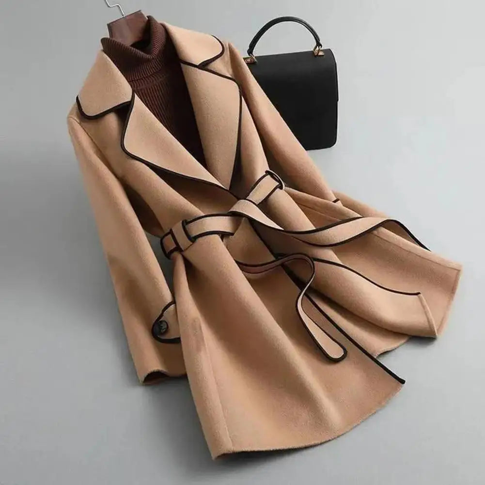 Women's long-sleeved belted trench coat with contrast piping and buttoned cuffs