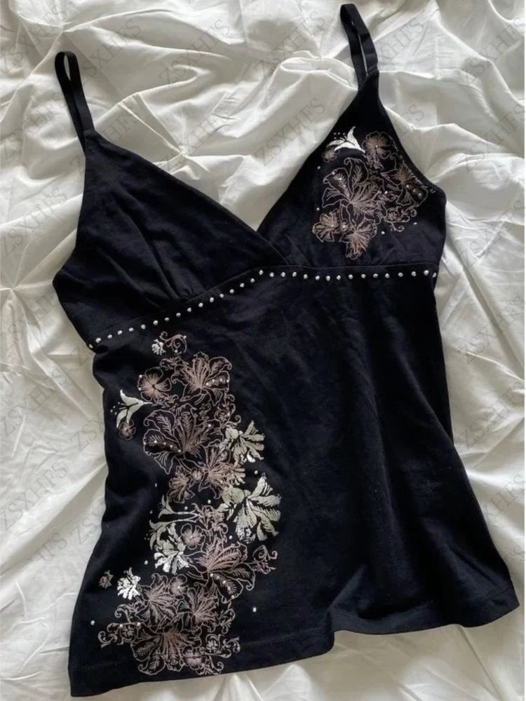 Black floral cami top with V-neckline and spaghetti straps
