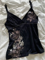 Black floral cami top with V-neckline and spaghetti straps