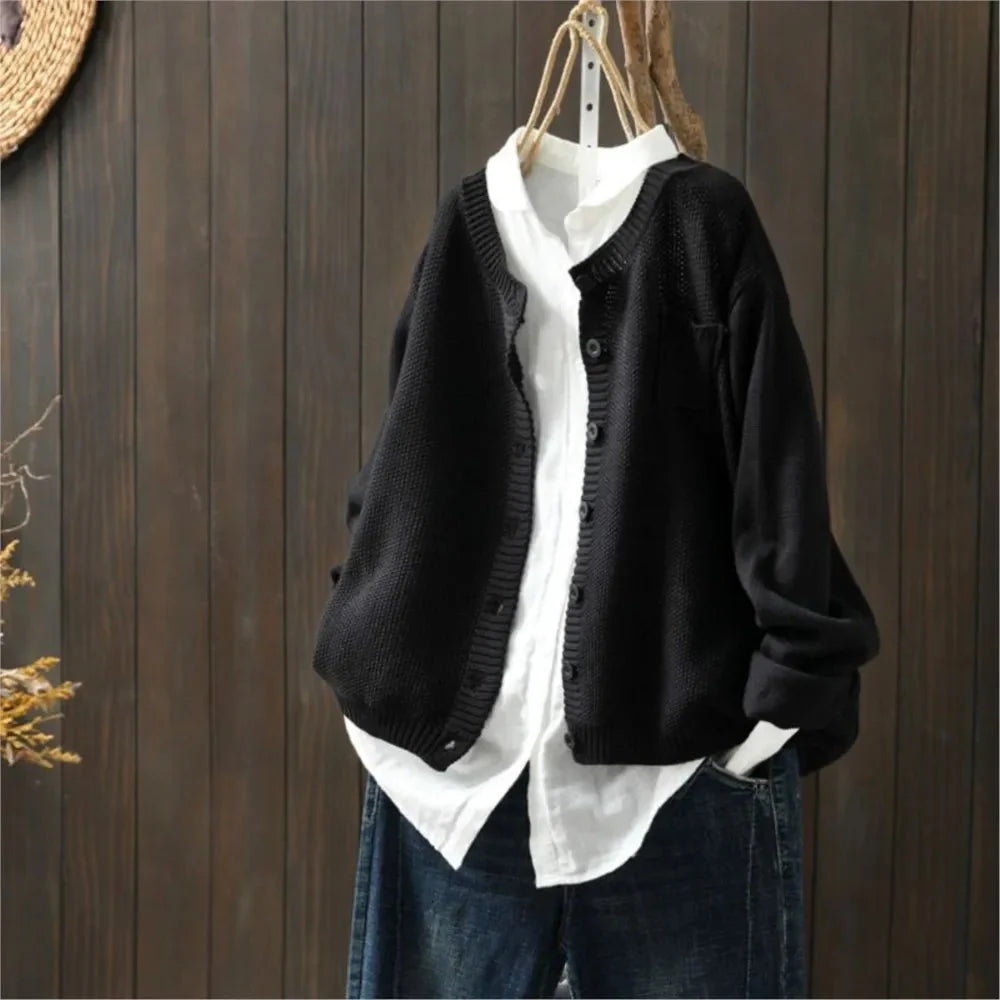Women's textured knit cardigan with buttons over a white shirt