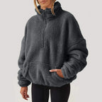Women's textured hooded half-zip sweater with long sleeves and front pocket
