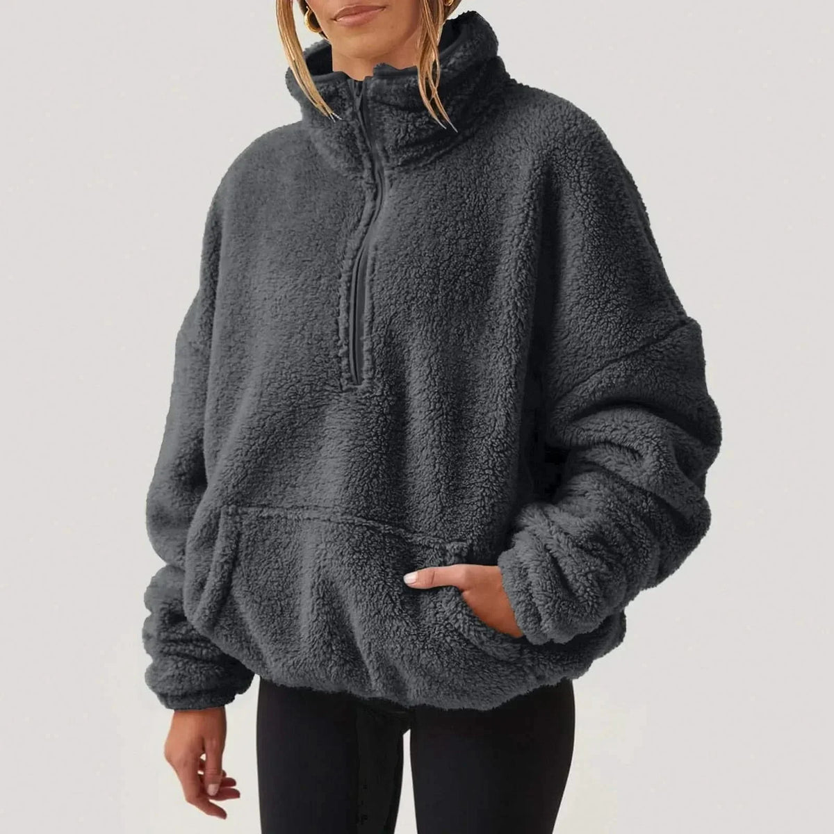 Women's textured hooded half-zip sweater with long sleeves and front pocket