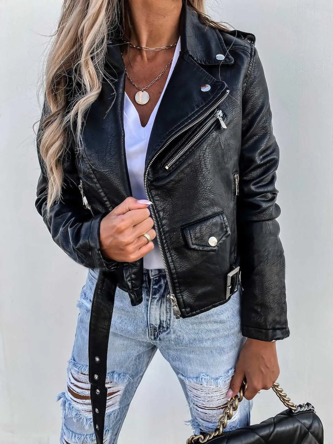Women's cropped biker jacket with lapels, zips, studs and belted waist
