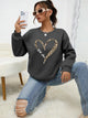 Women's crew-neck sweatshirt with leopard heart graphic and long sleeves