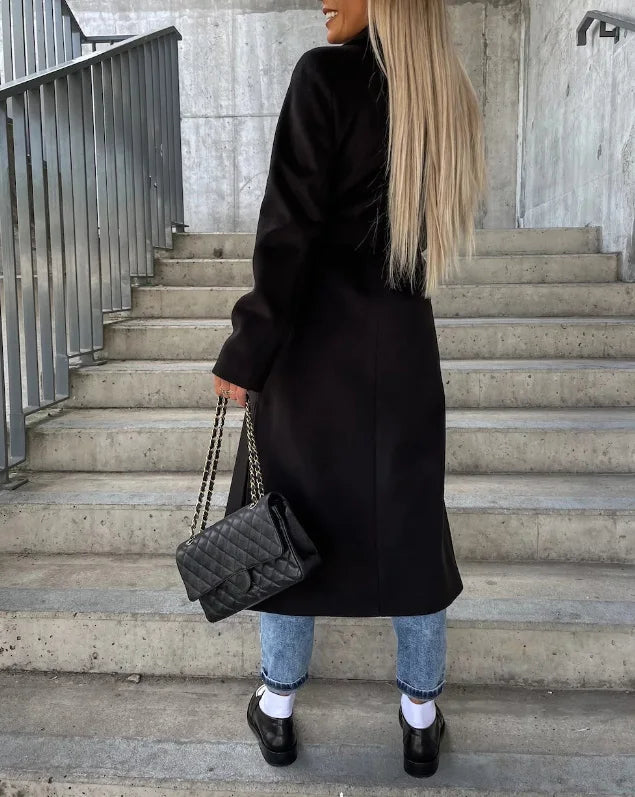 Women's long belted trench coat with notched lapels and double-breasted buttons