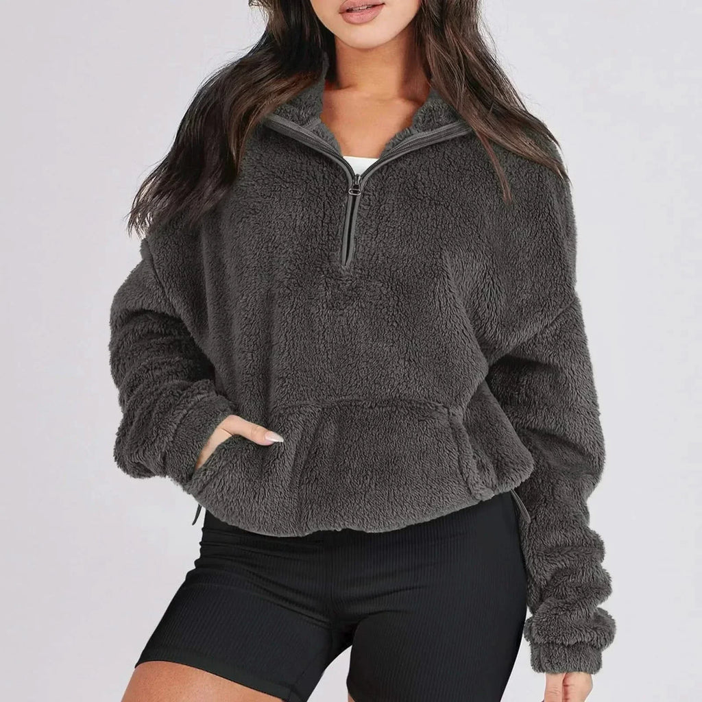 Women's textured hooded half-zip sweater with long sleeves and front pocket