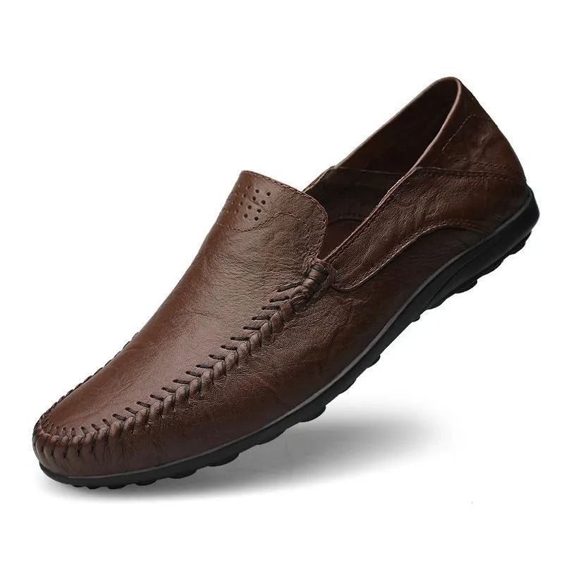 Men's slip-on leather loafers with rounded moc toe and stitched detailing
