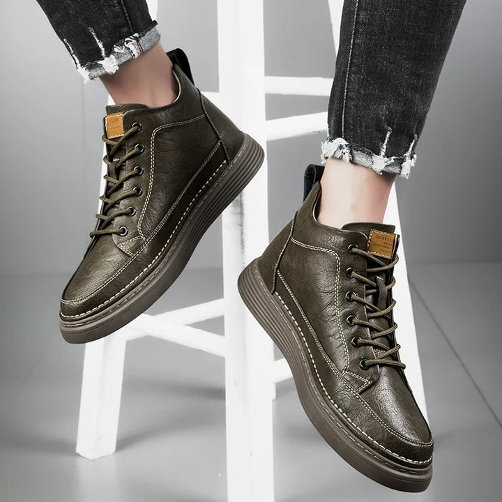 Men's lace-up ankle boots with stitched panels and platform sole
