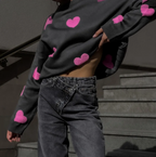 Women's knitted jumper with scattered contrasting motifs