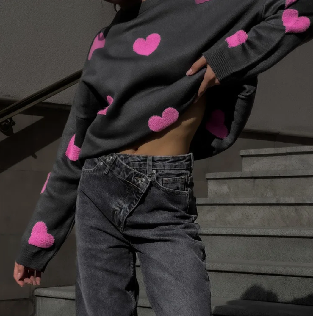 Women's knitted jumper with scattered contrasting motifs